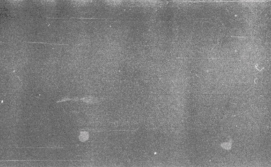 Noisy film frame with heavy scratches, dust and grain