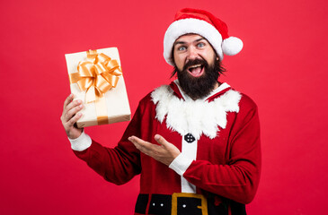 Shopping Center. merry christmas. cheerful bearded man in santa claus costume. brutal hipster...