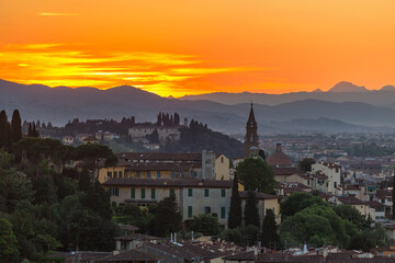 Fototapeta na wymiar View at Florence in sunset light with the mountains
