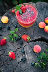 Blended Colorful Strawberry Apricot Sugar Free Smoothie with Chia Seeds and Mint