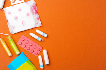 Flat lay of Pads, tampons and pills