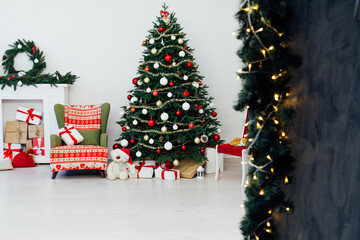 Christmas tree with fireplace presents the decor of the house New Year