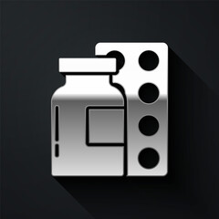 Silver Pills in blister pack icon isolated on black background. Medical drug package for tablet, vitamin, antibiotic, aspirin. Long shadow style. Vector.