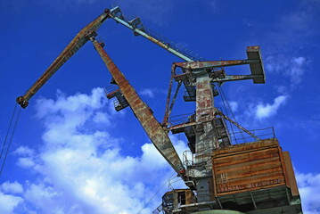 big German old crane in river port
