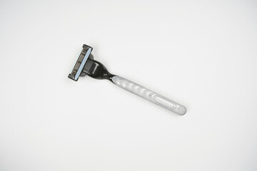 top view of triple razor blade over white background