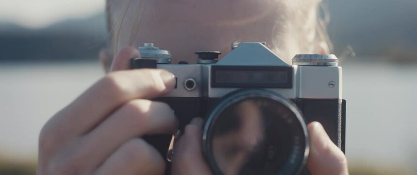Blue eye woman take analogue photo look at camera close up portrait
