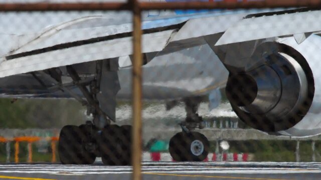 Airliner taxiing to runway before departure, close-up