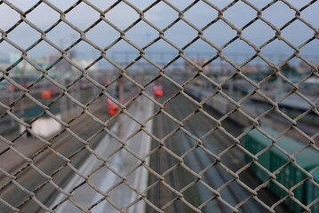 Mesh fencing over railway tracks