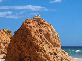 Red cliffs at a beautiful Algarve beach in Portugal