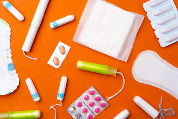 Flat lay of Pads, tampons and pills