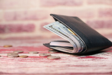 Close up of cash in wallet on table.