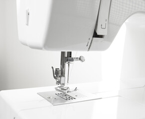 Close-up of sewing machine and sewing needle in fashion design studio