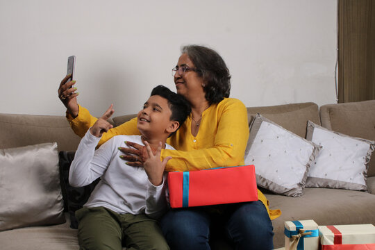 Happy Moments With Grandma, Indian/asian Senior Lady Spending Quality Time With Her Grand Son Taking Selfie.