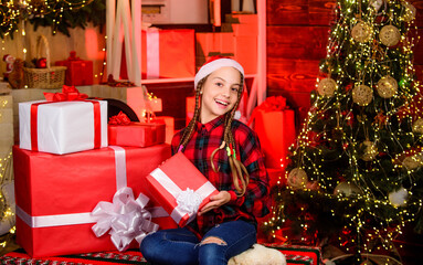Obraz na płótnie Canvas All I want for Christmas. morning before Xmas. family holiday time. new year is coming. Kid enjoy the holiday. child girl with xmas present. hello from santa claus. small happy girl at christmas tree