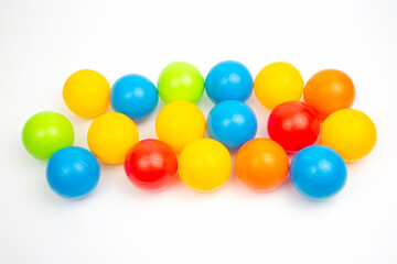 Colored plastic balls on white background. leisure and game items. round objects
