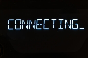A text message that appears with a deep glow: connect. Luminous text on the computer screen, monitor, or LCD display.