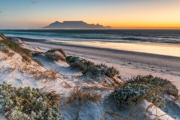 Naklejka premium Table Mountain at Sunset from Big Bay, Cape Town, South Africa
