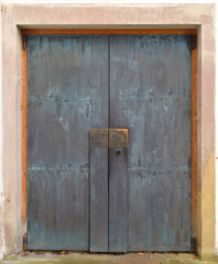 Old rusty, heavy wooden door. close up