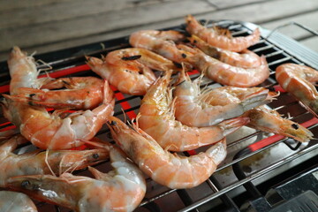 Grilled shrimps on the flaming grill.