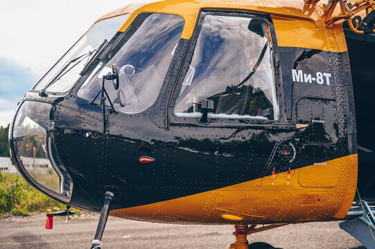 Sortavala, Karelia, Russia, August 15, 2020. Russian air force multirole helicopter Mil Mi-8. American Medical Clinic military medium twin-turbine helicopter in black and yellow orange