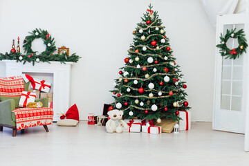 Christmas tree with fireplace presents the decor of the house New Year