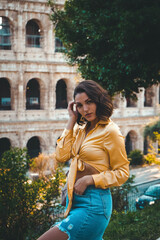 Young woman posing near Colosseum