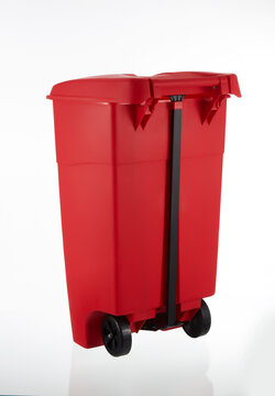 A picture of a large red rubbish bin with wheels on