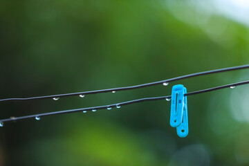 Close up clothes dryer and plastic clips.