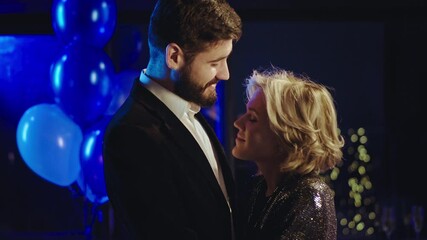 Young beautiful couple at birthday party have great evening they dancing very romantic kissing they feeling very in love