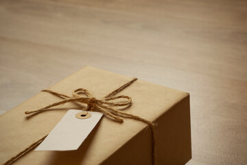 Tagged parcel on the table. Luggage, gift, parcel, delivery service, sending, receiving,...