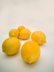 Perspective of lemons. Yellow, colorful and juicy fruits on white background.