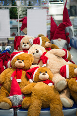 a lot of bears in the store on the shelves, toys for children, a new year, gifts for Christmas, shop on holidays, space for text