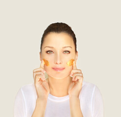 Concept of rejuvenation.Volume lifting.Applying the cream