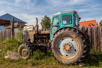 Old, broken, rusty tractor Belarus