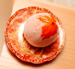 Frozen fruit the fruit the frost on the plate on the background of the table