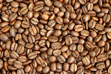 Texture of roasted arabica coffee beans.