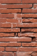 Old brick exterior wall. Grudge brown brick abstract background. Brick texture.