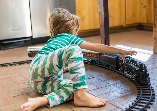 4 year old boy playing with toy train