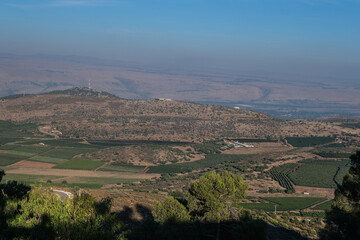 Fototapeta na wymiar Naftali mountains range with keren naftali mountain, Hula valley, Golan Heights and Mount Hermon as seen from Kibbutz Malkia lookout point, located on iraeli-lebanese border in Upper Galilee, Israel.