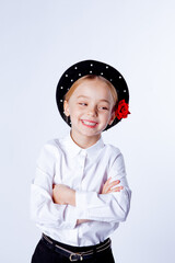 cute five year old girl in a black beret and formal clothes