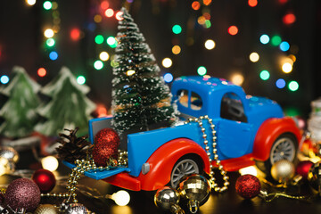 New year or Christmas composition with Christmas balls and a car toy