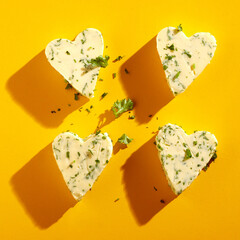 Four decorative heart-shaped butter pats