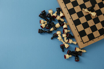Chess pieces and board on a blue background