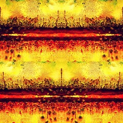 black paint with bright yellow red and orange futuristic abstract design on a rusty textured surface