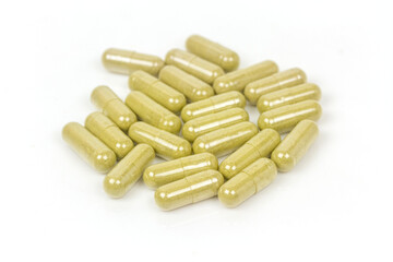 Close-up moringa oleifera capsule isolated on white background.