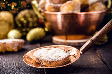 slice of fried bread with cinnamon and sugar in old copper skimmer. Dessert called 
