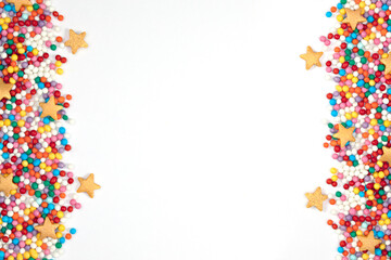 pastry stars and colored balls on the sides on a light background