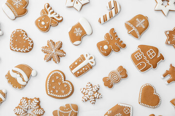 Different Christmas gingerbread cookies on white background, top view