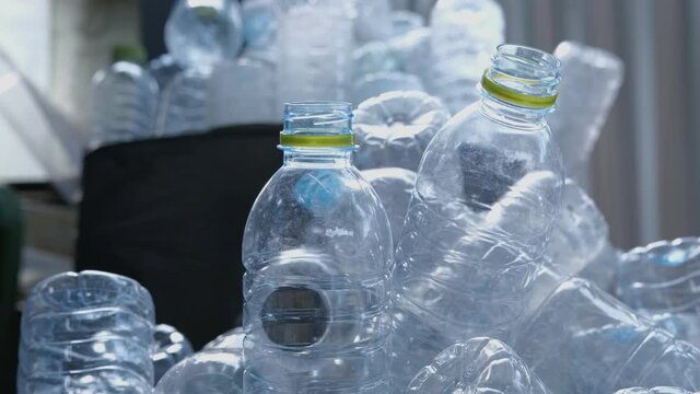used plastic drinking water bottles included for recycling. camera slider shots