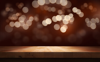 A Christmas wood tabletop product display with a blurred bokeh background and empty space to...